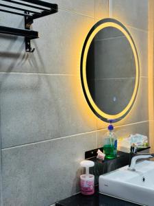 a bathroom with a sink and a mirror on a counter at Jac Urban Suites Luxury & Premium Staycation 10pax in George Town