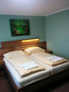 Een bed of bedden in een kamer bij Hotel Panon
