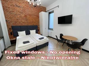 Postel nebo postele na pokoji v ubytování Pod Błękitnymi Podkowami