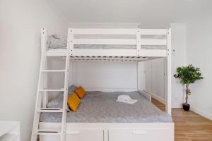 a white bunk bed in a small room at Lovely And New Apartment In Oura in Albufeira +18 photos