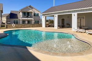 a swimming pool in front of a house at Blue Sky View in Kingsland