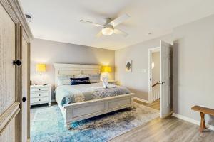 a bedroom with a bed and a ceiling fan at Creekside --- 26 Dockside Dr in Millville