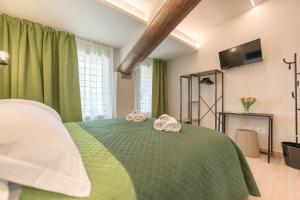 A bed or beds in a room at Soave Country House