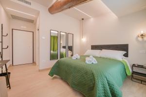 A bed or beds in a room at Soave Country House