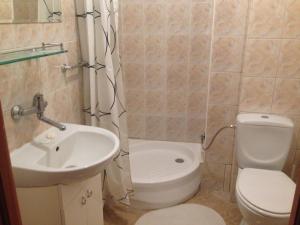 a small bathroom with a sink and a toilet at Dom wakacyjny Blisko Plaży in Gdynia +45 photos