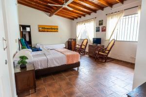 Giường trong phòng chung tại Villa Armonía - Santa Fé de Antioquia +18 ảnh