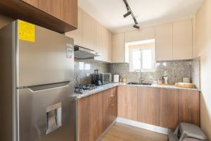 Kuchyň nebo kuchyňský kout v ubytování Elegante y versátil apartamento en Ensanche Ozama SDE