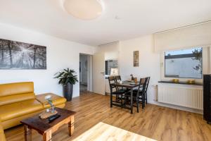 a living room with a couch and a table at Ferienwohnung Frank in Sundern
