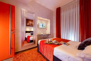 Postel nebo postele na pokoji v ubytování Hotel Ariston + 37 fotografií