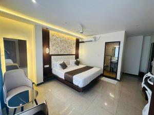 Letto o letti in una camera di Mysore Elite