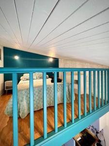 a balcony with a bed in a room at La Navette in Les Sables-d'Olonne +25 photos