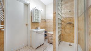 a bathroom with a toilet sink and a shower at Promenada Komfort, Sun & Snow in Świnoujście +61 photos