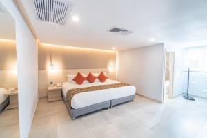 Postel nebo postele na pokoji v ubytování Hotel Barlovento