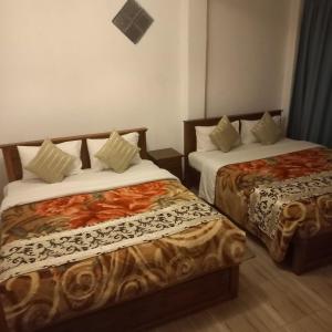 Postel nebo postele na pokoji v ubytování Pedro Resort & Bungalow Nuwara Eliya