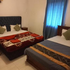 Postel nebo postele na pokoji v ubytování Pedro Resort & Bungalow Nuwara Eliya