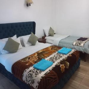 Postel nebo postele na pokoji v ubytování Pedro Resort & Bungalow Nuwara Eliya