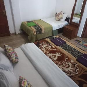 Postel nebo postele na pokoji v ubytování Pedro Resort & Bungalow Nuwara Eliya
