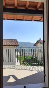 a view of the ocean from the balcony of a house at Caramaschi Verona Apartment in Negrar