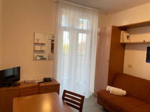TV a/nebo společenská místnost v ubytování Coccodrillo Hotel & Apartments