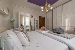 a room with three beds with towels on them at Casa Rustica Ivano in Biograd na Moru +65 photos