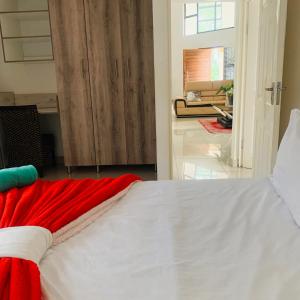 Ένα ή περισσότερα κρεβάτια σε δωμάτιο στο Elangeni Lodge