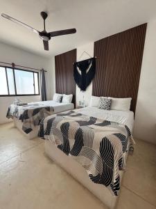 Postel nebo postele na pokoji v ubytování Hotel Mittoz Holbox
