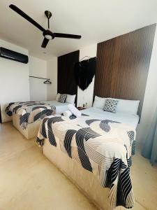 Postel nebo postele na pokoji v ubytování Hotel Mittoz Holbox