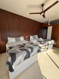Postel nebo postele na pokoji v ubytování Hotel Mittoz Holbox