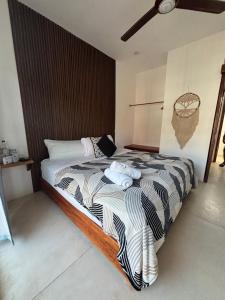 Postel nebo postele na pokoji v ubytování Hotel Mittoz Holbox