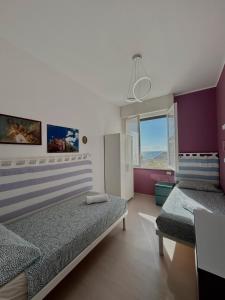 Postel nebo postele na pokoji v ubytování Appartamento Stella Marina + 14 fotografií