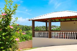 a gazebo with a view of a garden at Apart hotel Costa Verde#7 con cama Queen in Las Galeras