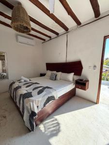 Postel nebo postele na pokoji v ubytování Hotel Mittoz Holbox