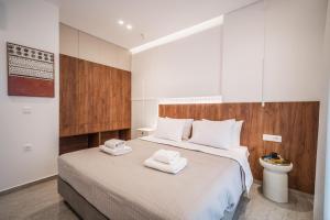 A bed or beds in a room at Margiani Studio & Apartment
