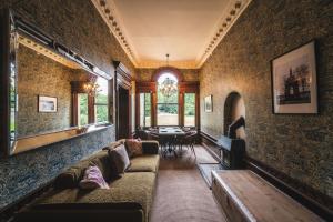 a living room with a couch and a table at The Chapel Suite in Marske