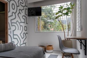 TV a/nebo společenská místnost v ubytování Nomadia Coliving Boutique