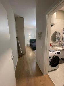 a living room with a washer and dryer at Garden Building Luxury Apartment in Tirana