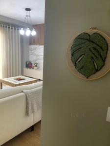 a bedroom with a bed with a painting on the wall at Garden Building Luxury Apartment in Tirana