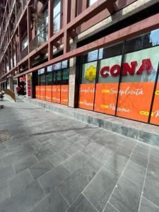 a building with signs on the side of it at Garden Building Luxury Apartment in Tirana