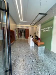 an empty lobby of a building with a reception desk at Garden Building Luxury Apartment in Tirana