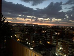 a view of a city at night at Garden Building Luxury Apartment in Tirana