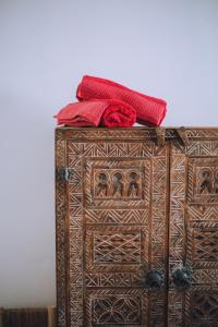 a wooden box with a red ribbon on top of it at The Loft in Marrakech