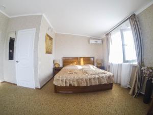 Postel nebo postele na pokoji v ubytování Galian Hotel