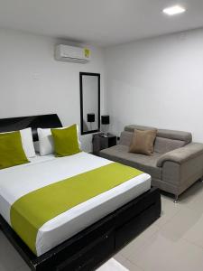 Ένα ή περισσότερα κρεβάτια σε δωμάτιο στο HotelGS