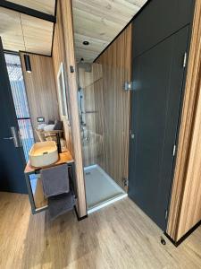 a bathroom with a shower and a sink at Domos de Matanzas in Matanzas