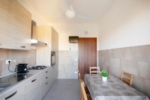 Kuchyň nebo kuchyňský kout v ubytování Talenti Boutique Apartment