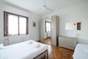 Postel nebo postele na pokoji v ubytování Talenti Boutique Apartment