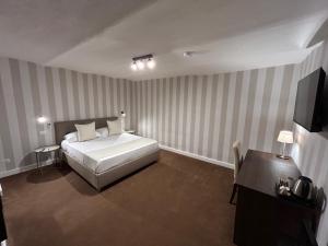 Cama ou camas em um quarto em B&B Baciami Ancora