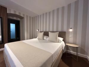 Cama ou camas em um quarto em B&B Baciami Ancora