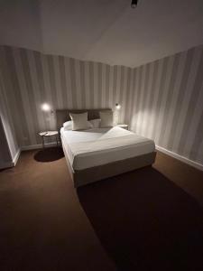 Cama ou camas em um quarto em B&B Baciami Ancora