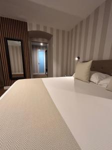 Cama ou camas em um quarto em B&B Baciami Ancora